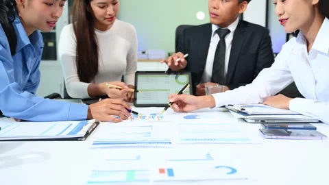 Businesspeople while collaborating on a new project in an office. Group of .. Video stock 313858004