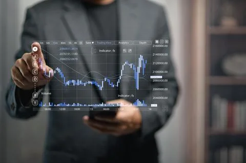 Businessperson Analyzing Financial Data On Transparent Digital Screen In Offi Stock Photos