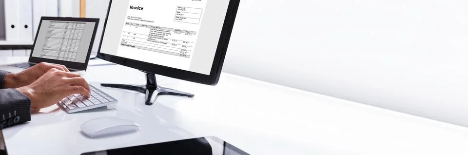 Businessperson Checking Invoice On Computer Stock Photos