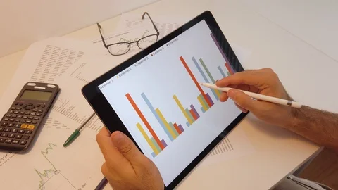 Businessperson desktop visualizing statistics with new technologies, tablet p Stock Footage 119478269