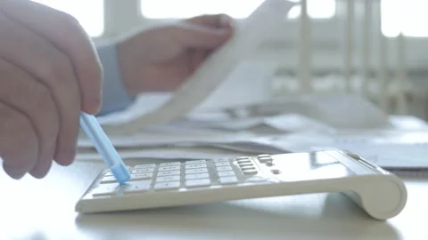 Businessperson Makes Calculations Using Adding Machine Checking Payment Papers. Stock Footage 154195549