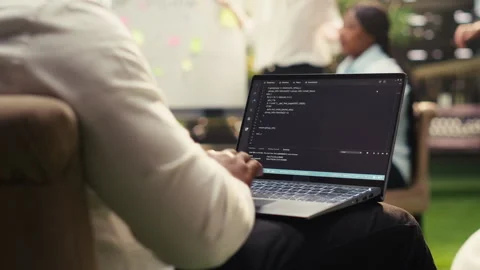Businessperson programmer using laptop with binary code during strategy session Video stock 338383981