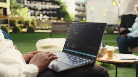 Businessperson programmer using laptop with binary code during strategy session Video stock 338388579