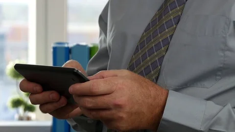 Businessperson Using Tablet Internet Application Accessing Online Data Base 動画素材 85259448