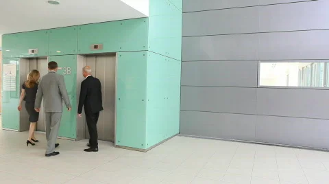 Businessteam of three using elevator TWO TAKES Stock-Footage 492235
