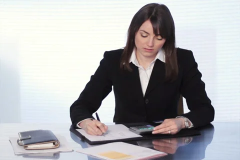 Businesswoman adding bills. SD. Stock Footage