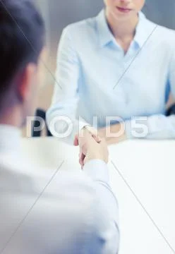 Businesswoman and businessman shaking hands Stock Photos