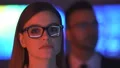 The businesswoman and a businessman smiling in the dark office 4k or 4k+ Resolution