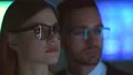 The businesswoman and a businessman smiling on the hologram background 4k or 4k+ Resolution