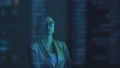 The businesswoman and a businessman standing near the display 4k or 4k+ Resolution