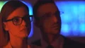 The businesswoman and a man smiling in the dark office 4k or 4k+ Resolution