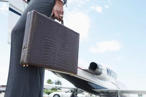 Businesswoman With Briefcase At The Airport Stock Photos