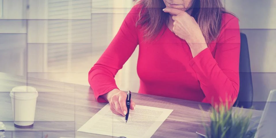 Businesswoman checking document, geometric pattern Stock Photos