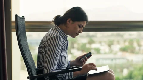 Businesswoman comparing data on tablet computer and smartphone HD Stock Footage 48709729