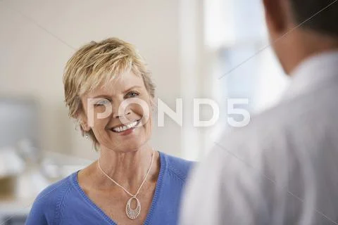 Businesswoman Discussing With Male Colleague Stock Photos