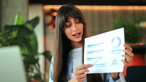 Businesswoman Explaining Data Analytics and Business Reports in a Modern Office Stock-Footage 313034386