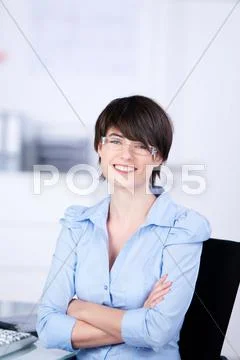Businesswoman with folded arms Stock Photos