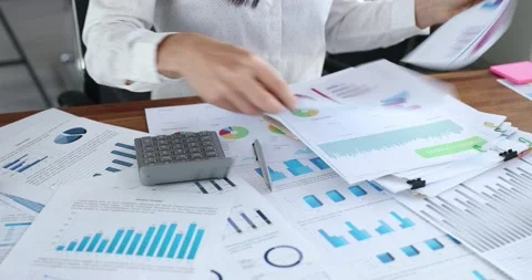 Businesswoman generates financial business reports of marketing statistics Stock Footage