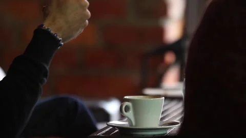 Businesswoman gesturing hand while talking at coffee table on meeting. Stock Footage 313815155