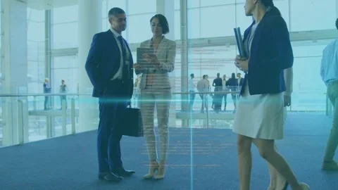 Businesswoman gesturing at tablet initiating code overlay, man holding case, Video stock 335762180