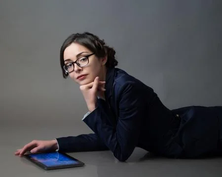 Businesswoman in glasses   with  gadget Stock Photos