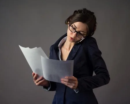 Businesswoman in glasses  talking Stock Photos