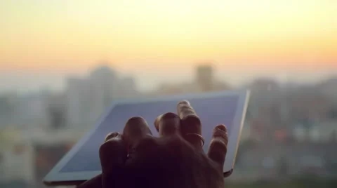 Businesswoman hand using tablet in the office with glass window over city at Stock Footage 59149857