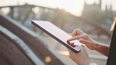 Businesswoman Hands Using Digital Tablet in Sunny City. SLOW MOTION. STEADICAM Stock Footage