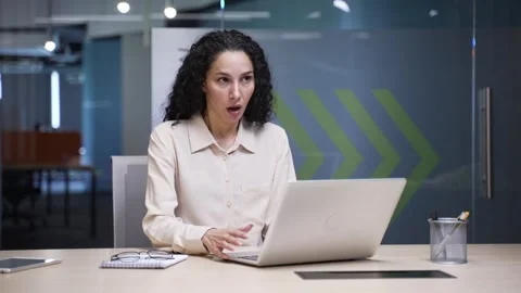 Businesswoman having a panic attack while working on a laptop sitting Stock Footage 297295035