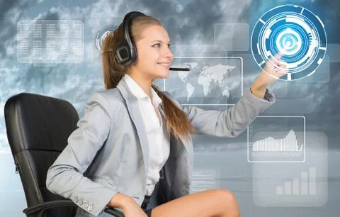Businesswoman in headset using virtual interface Stock Photos