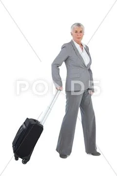 Businesswoman with her luggage Stock Photos
