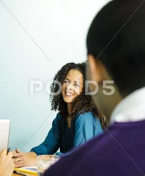 Businesswoman Laughing In Office Meeting