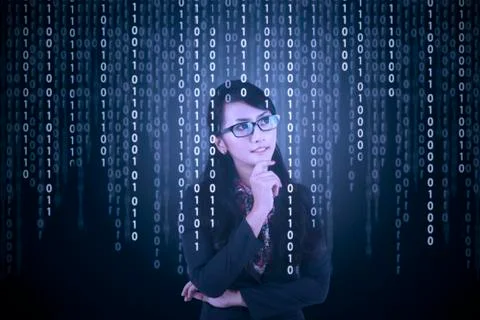 Businesswoman looking at binary code Foto stock