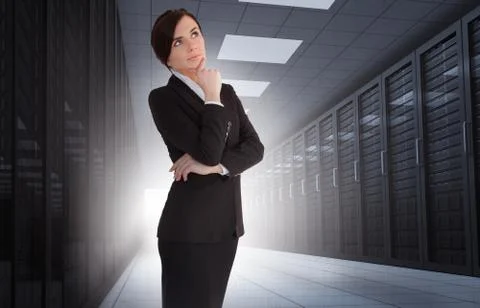 Businesswoman looking thoughtful in data center Stock Photos