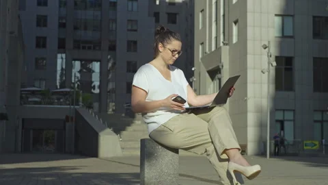 Businesswoman looking through documents in a folder near the business center. Stock Footage 247149278