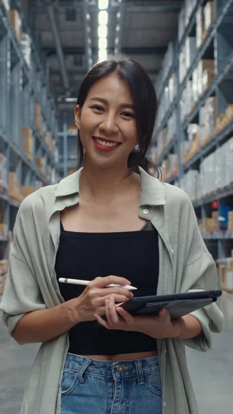 Businesswoman manager smiling charmingly looking at camera hold tablet stand. Stock Footage 336003553