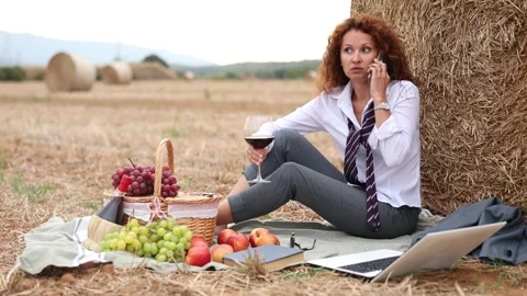 Businesswoman in office attire seeking privacy and solitude in nature, talking Stock Footage 310950348