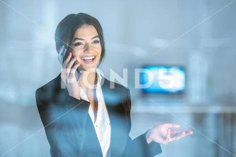 The businesswoman phone near the window Stock Photos