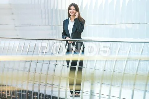 The businesswoman phone on the office balcony Stock Photos