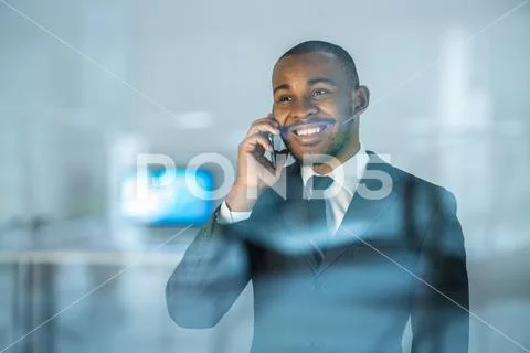 The businesswoman phone over the window Stock Photos