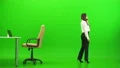 The businesswoman phones on the green background 4k or 4k+ Resolution