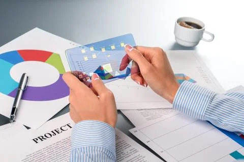 Businesswoman processing data on smartphone. Stockfoto's