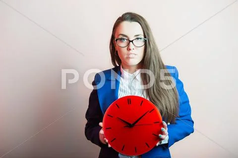 Businesswoman with red clock Stock Photos