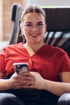 A businesswoman resting on a short break from work in a modern startup cow... Stock Photos