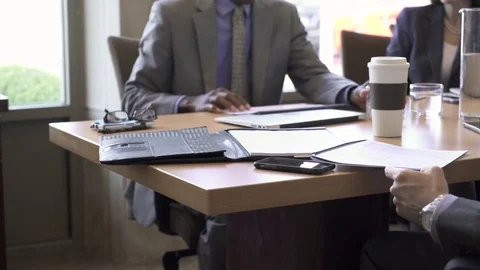 Businesswoman shaking hand with colleague in board room Stock Footage