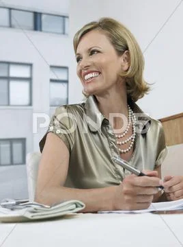 Businesswoman Signing Contract In Restaurant Stock Photos