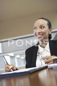 Businesswoman Signing Document Stock Photos