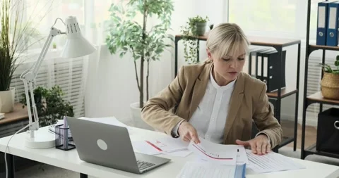 Businesswoman Sorting Through Documents and Rushing in the Office Video stock 248371828