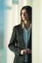 The businesswoman stand near the column Photo