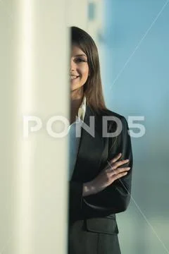 The businesswoman stand over the column Stock Photos